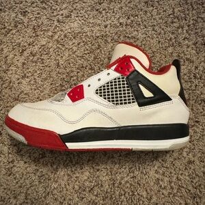 Air Jordan 4s, white, red, and black colorway.